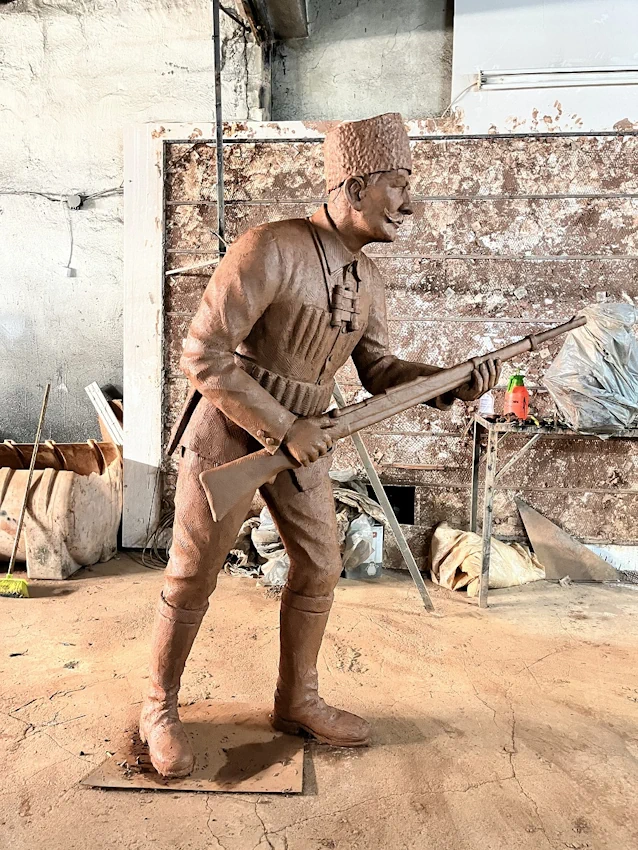 Avci Mahmut Statue Side Profile View