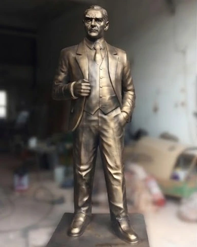 Bronze full-body Ataturk statue in a suit with an upright posture