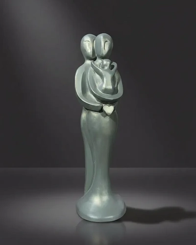 Abstract family sculpture with mother, father and baby figures, symbolizing love